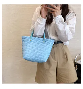 Light blue woven tote handbag, stylish shoulder bag with classic intrecciato texture design.