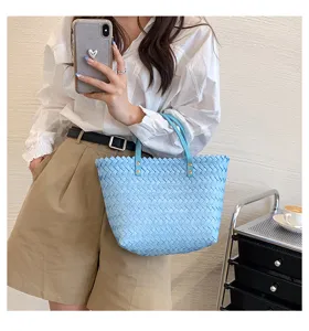 Chic light blue woven leather shoulder tote bag for women, stylish daily casual handbag.