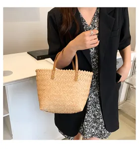 Close-up detail of stylish straw woven tote handbag, elegant casual daily fashion accessory.
