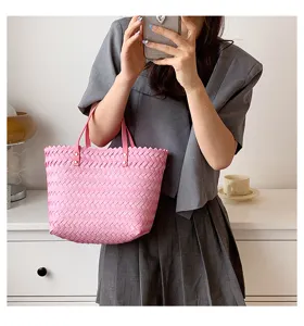 Pink woven straw shoulder tote bag, stylish casual handbag for women spring daily use.