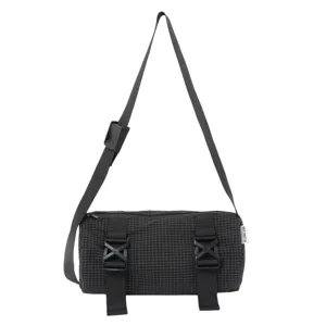 Black grid crossbody bag with double buckle straps and adjustable shoulder strap for travel.