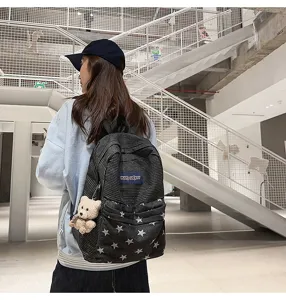Corduroy star print canvas student backpack detail view showcasing multi-compartment design.
