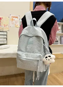 Sac a dos bleu clair avec motif etoiles et pendentif peluche pour ecolier grande capacite.