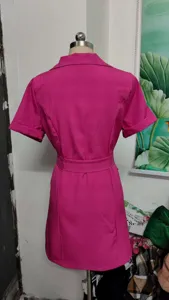 Women pink lapel short sleeve dress back view detail, elegant waist-cinching summer dress.