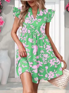 Detail view of the elegant green floral V-neck dress, showing flutter sleeves and fabric.
