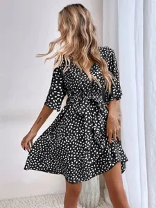 Black and white polka dot V-neck short sleeve wrap dress with waist tie for women fashion.