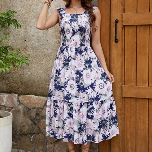 Detailed shot of women's floral sleeveless tiered sling midi dress with rayon fabric.