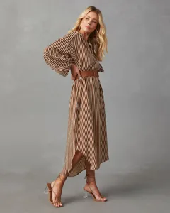 Detailed view of the striped long-sleeve shirt dress with chic belt and V-neckline.