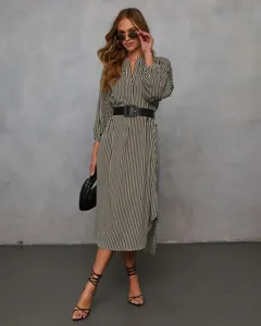 Striped V-neck midi dress detail, long sleeves with black belt, elegant fall outfit.