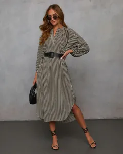 Detailed view of women's elegant long sleeve V-neck vertical striped midi dress with belt.