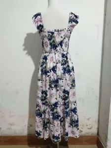 Floral print rayon maxi dress detail, square neck ruffle sleeve cinched waist design.