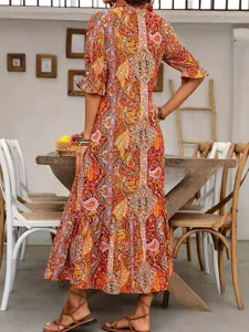 Back view detail of women vintage boho floral print midi dress with ruffle sleeves.