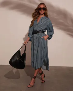 Detailed view of the autumn fashion V-neck striped shirt dress with belt and hobo bag.