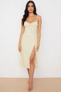 Close-up detail of women summer floral slip dress with stylish high slit and sweet straps.