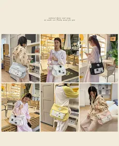 Cute canvas messenger bag for school girls, color block crossbody bag with cute cat pendants.