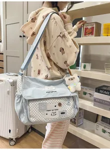 Cute color-block canvas crossbody shoulder bag for student daily school use with plush pendant.