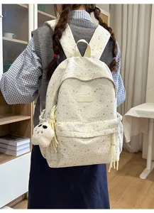 Joli sac à dos scolaire élégant avec motif d'étoiles, grande capacité et joli pendentif.