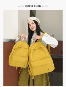 Sac à dos en toile jaune style collégien pour étudiants, grande et petite taille, détail.