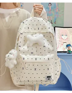 Süßer gemusterter Canvas Rucksack mit Plüsch Knochen und süßem Hund Anhänger für Schule.