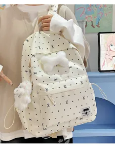 Niedlicher Cartoon Student Rucksack mit großer Kapazität, Punkten, Schleifen und Plüschanhängern.