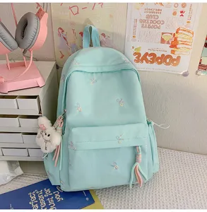 Mochila bonita azul claro con bordado de lazos para estudiantes, gran capacidad.
