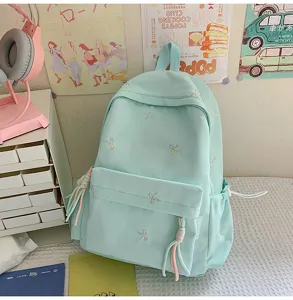 Mochila verde menta bonita con bordado de lazos, gran capacidad para la escuela y uso diario.