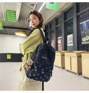 Stylish star denim backpack large capacity school bag for students casual daily wear.