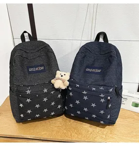Stylish denim corduroy school backpack with star pattern and spacious storage capacity.