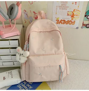 Mochila rosa para estudiantes con bonito bordado de lazo, gran bolso escolar para uso diario.