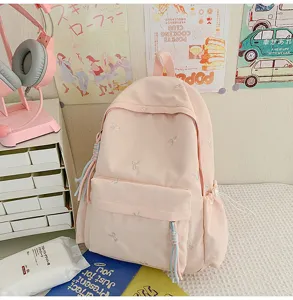 Mochila rosa bonita con bordado de lazo y gran capacidad para niñas escolares