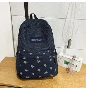 Blue denim star backpack detail view, striped top design, spacious school bag for students.