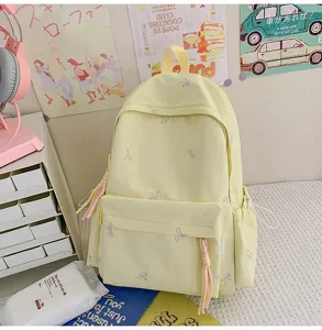 Mochila amarilla bonita con lazos para estudiantes, gran bolso escolar de estilo dulce diario.