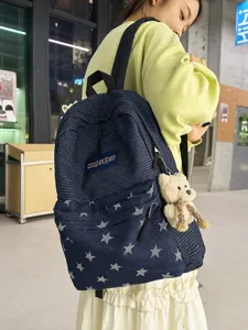 Stylish denim backpack with striped pattern, star details, and cute bear pendant for daily use.