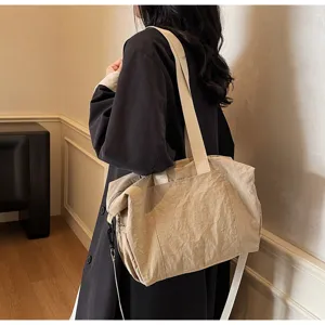 Detailed view of the casual beige tote bag, showcasing large capacity and versatile shoulder strap.