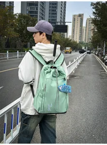 Grand sac à dos de voyage fitness extérieur pour étudiants, cartable vert clair tendance avec cordon.