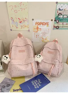 Joli sac à dos rose à motif d'étoiles avec pendentif en peluche, grande capacité.