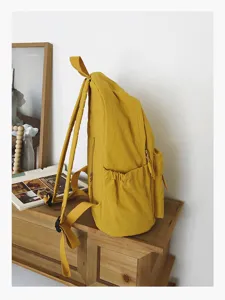 Élégant sac à dos d'école en toile pour femmes, sac décontracté avec poches pratiques.