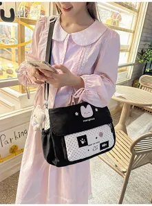 Cute black and white contrast messenger bag for students, stylish canvas shoulder bag.