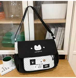 Cute black and white canvas messenger bag for school girls, stylish color block crossbody bag.
