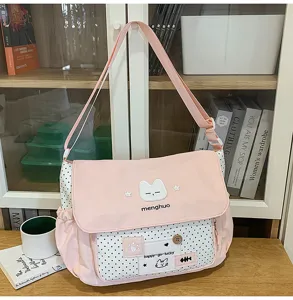 Cute pink colorblock canvas messenger shoulder bag for students, stylish and practical design.