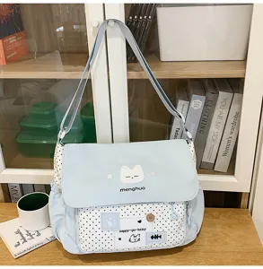 Cute canvas crossbody bag for girls, featuring sweet cat embroidery and polka dot design.