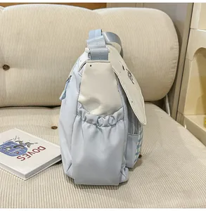 Dulce bolso bandolera azul claro para estudiantes, bolso cruzado informal con bolsillos laterales.