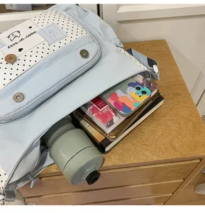 Cute polka dot canvas shoulder bag for students, stylish color blocking daily crossbody bag.