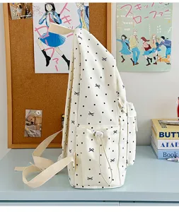 Süßer Canvas-Rucksack mit Punkten und Schleifen für Schüler, großer lässiger Schulranzen.