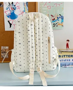 Schicker Pünktchen-Rucksack für Schüler mit Schleifenmuster, großer Alltags-Schulranzen.