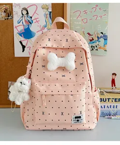Süßer rosa Pünktchen Schulranzen mit Plüschknochen Anhänger und Schleifen für den täglichen Bedarf.