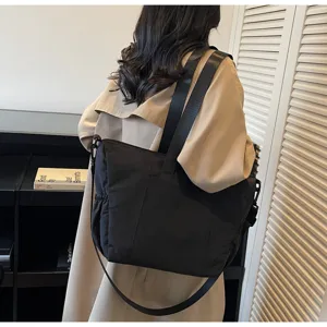 Detail view of casual black large capacity women tote shoulder bag for daily travel use