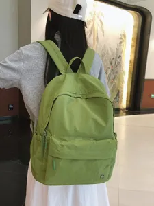Sac à dos d'école coloré et décontracté pour femme, sac en nylon élégant avec poches.