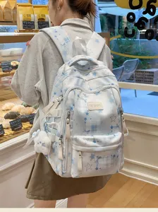 Sac à dos d'école bleu à carreaux et étoiles pour étudiante, grand format quotidien.