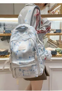 Joli sac à dos scolaire motif étoile style ins avec pendentif en peluche mignon.